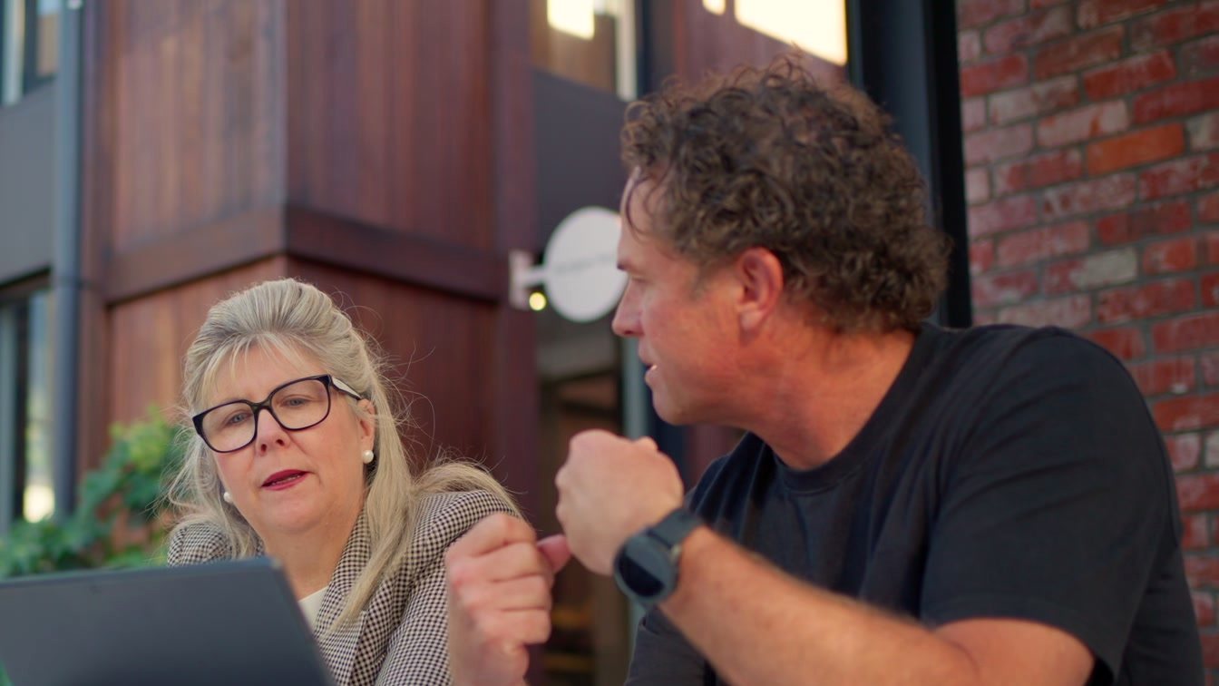 Matt explaining an idea to a client across the table