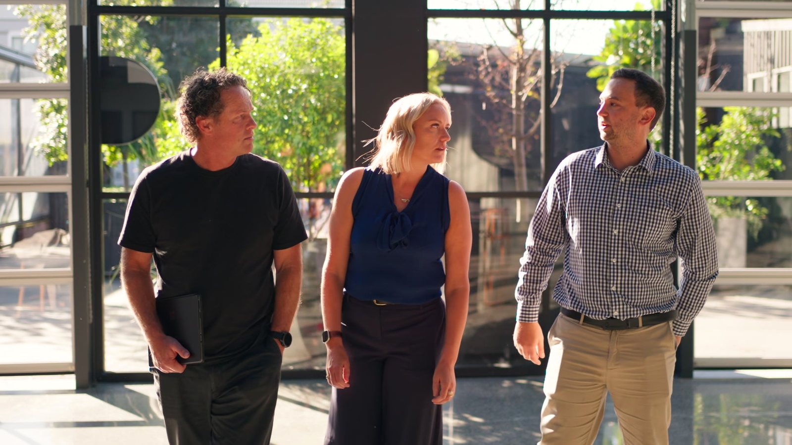 Matt, Mell and a client walking and talking outside